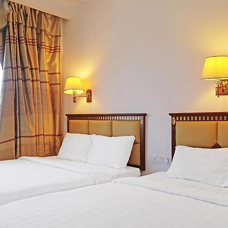 Super Oyo 90464 Borneo Suites Hotel Kota Kinabalu Esterno foto